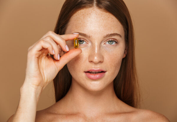 Beauty,Image,Of,Caucasian,Shirtless,Woman,20s,Holding,Vitamin,Pill