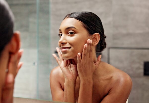 Bathroom,,Mirror,And,Woman,With,Touch,For,Skincare,,Self,Care