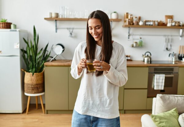 Bright,And,Inviting,Atmosphere,As,A,Young,Woman,Sips,Her